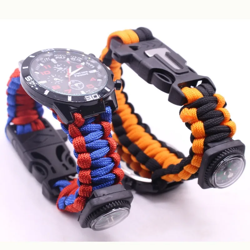 Outdoor Adventure Watches - นาฬิกาอเนกประสงค์สำหรับกิจกรรมกลางแจ้ง พร้อมเชือกถักแบบสร้อยข้อมือ มีไฟแช็ก เข็มทิศ และชุดอุปกรณ์เอาตัวรอด ดีไซน์เจ็ดแกนสำหรับการผจญภัย